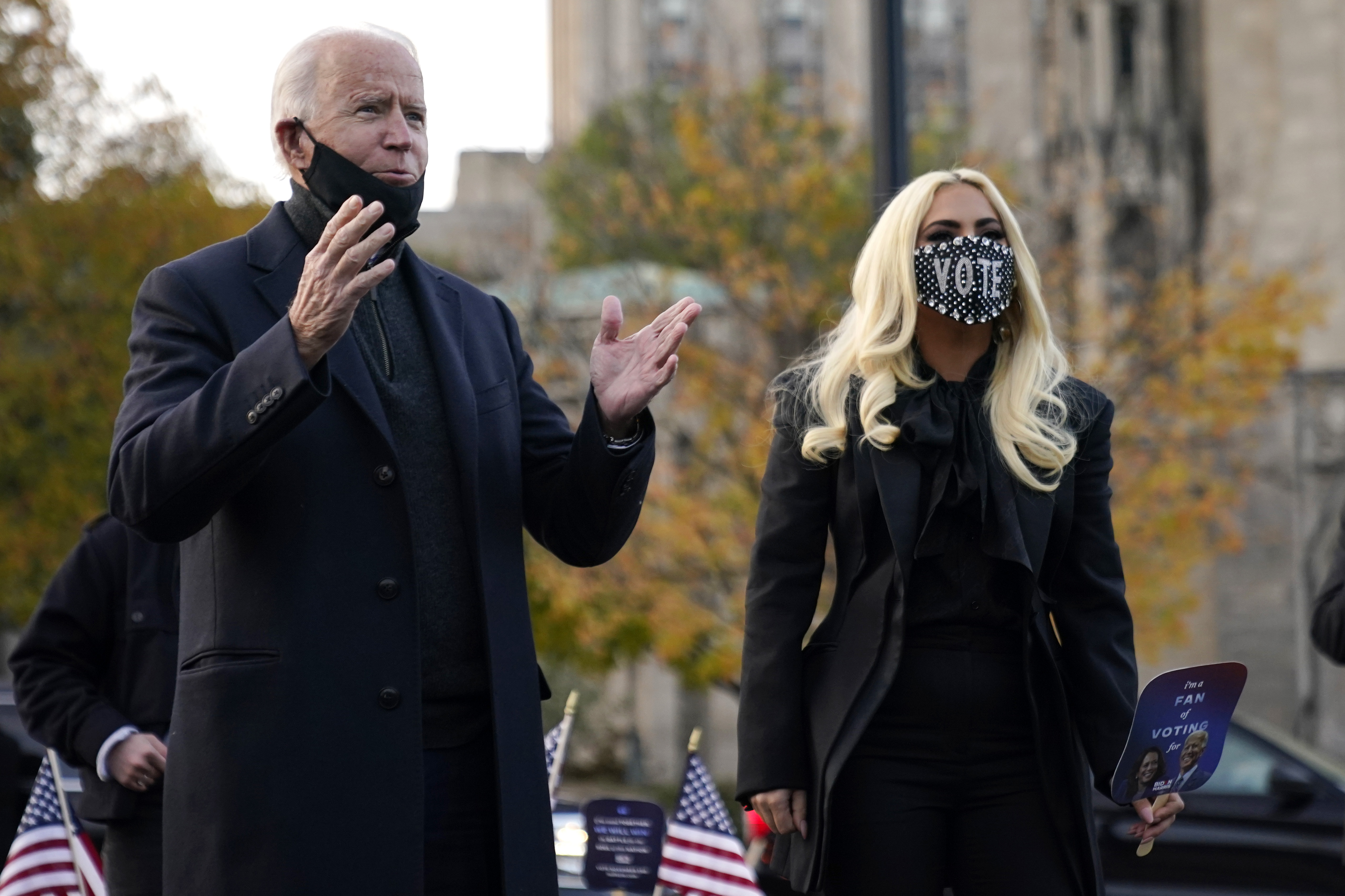 Democratic presidential candidate former Vice President Joe Biden stands with Lady Gaga, right, Monday, Nov. 2, 2020, in Pittsburgh, Pa. (AP Photo/Andrew Harnik)